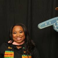 man points foam finger at soon to be graduate